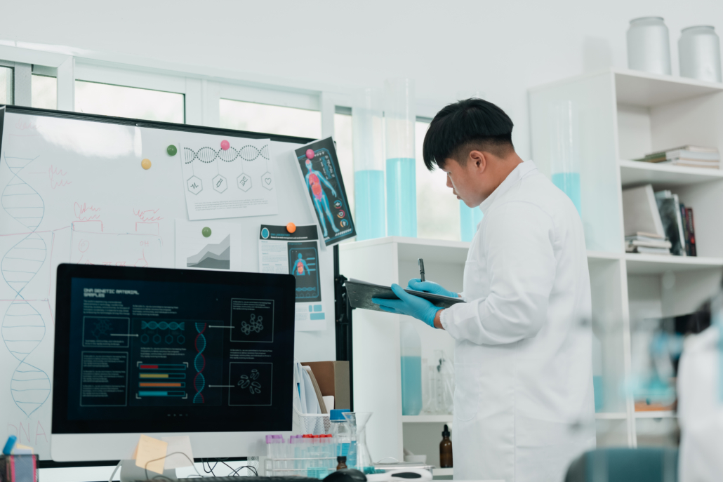 Life sciences professional in a lab coat working in a medical laboratory, part of the specialized audience served by a life science marketing agency.